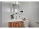 Bathroom with a wood cabinet vanity and a bright mirror above at 4047 Maple Hill Rd, Las Vegas, NV 89115