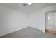 Bedroom with neutral carpet and white walls, adjoining a doorway at 4047 Maple Hill Rd, Las Vegas, NV 89115