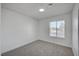 Bedroom featuring neutral carpet, a window, and bright walls at 4047 Maple Hill Rd, Las Vegas, NV 89115