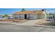 Single story home features a long driveway and desert landscaping at 4047 Maple Hill Rd, Las Vegas, NV 89115