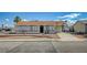 Inviting single-story home featuring a well-manicured front yard and a classic desert landscape at 4047 Maple Hill Rd, Las Vegas, NV 89115