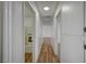 A hallway with wood floors and a view of the bathroom at 4047 Maple Hill Rd, Las Vegas, NV 89115
