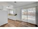 Bright kitchen with a breakfast bar, white cabinetry, and sliding glass doors at 4047 Maple Hill Rd, Las Vegas, NV 89115