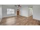 A well-lit living space with wood-look flooring and a large window at 4047 Maple Hill Rd, Las Vegas, NV 89115