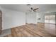 Open-concept living area with wood-look flooring and easy access to the kitchen at 4047 Maple Hill Rd, Las Vegas, NV 89115