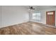 A naturally lit living room with wood-look floors and neutral decor at 4047 Maple Hill Rd, Las Vegas, NV 89115