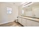 Bathroom featuring a double sink vanity, a large mirror, and a shower-tub combination at 4118 Beech Family St, Las Vegas, NV 89115