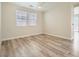 Spacious bedroom with modern flooring, a ceiling fan, and abundant natural light at 4118 Beech Family St, Las Vegas, NV 89115