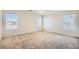 Bright bedroom featuring neutral walls, plush carpet, and multiple windows for ample natural light at 4118 Beech Family St, Las Vegas, NV 89115