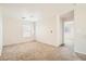 Bright bedroom featuring plush neutral carpeting, natural light from windows, and a modern ceiling fan at 4118 Beech Family St, Las Vegas, NV 89115