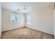 Bright bedroom featuring neutral walls, plush carpet, and multiple windows for ample natural light at 4118 Beech Family St, Las Vegas, NV 89115