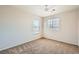 Bright bedroom featuring neutral walls, plush carpet, and multiple windows for ample natural light at 4118 Beech Family St, Las Vegas, NV 89115