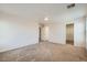 Spacious carpeted bedroom boasts neutral tones, dual closets, and an open layout with multiple entryways at 4118 Beech Family St, Las Vegas, NV 89115