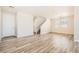 Open living area with neutral paint, wood-look flooring, and stairway access at 4118 Beech Family St, Las Vegas, NV 89115