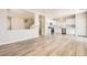 Open-concept living room features wood-look flooring, neutral tones, and ample natural light at 4118 Beech Family St, Las Vegas, NV 89115
