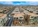 An aerial view highlights the community's vibrant architecture, landscaping, and proximity to mountain views at 4336 Guava Ct # 0, Las Vegas, NV 89135