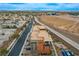 Aerial view of a modern home showcasing its rooftop deck and community setting in Las Vegas at 4336 Guava Ct # 0, Las Vegas, NV 89135