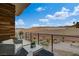 Inviting balcony space with comfortable seating, views of the desert landscape, and modern railings at 4336 Guava Ct # 0, Las Vegas, NV 89135