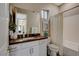 Bright bathroom with a brown countertop vanity, framed mirror, and tub-shower combination at 4336 Guava Ct # 0, Las Vegas, NV 89135
