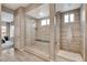 This bathroom showcases a spacious glass shower with a built-in bench and elegant tile work at 4336 Guava Ct # 0, Las Vegas, NV 89135