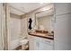 Modern bathroom offering a shower-tub combo, stylish vanity, and ample storage at 4336 Guava Ct # 0, Las Vegas, NV 89135