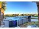 Community pool with crystal-clear water and relaxing lounge chairs, and desert landscaping at 4336 Guava Ct # 0, Las Vegas, NV 89135