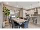 Elegant dining room with a modern table, stylish chairs, and a view into the contemporary kitchen at 4336 Guava Ct # 0, Las Vegas, NV 89135
