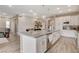 Spacious kitchen with stainless steel appliances, large island with hanging lights, and open-concept design at 4336 Guava Ct # 0, Las Vegas, NV 89135