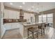 Bright, modern kitchen with stainless steel appliances and a large island with bar seating at 4336 Guava Ct # 0, Las Vegas, NV 89135