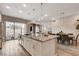 Contemporary kitchen featuring a large island, stainless steel appliances, and open floor plan with a patio view at 4336 Guava Ct # 0, Las Vegas, NV 89135
