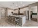 Modern kitchen with a large island, stylish seating, stainless steel appliances, and ample cabinet space at 4336 Guava Ct # 0, Las Vegas, NV 89135