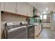 Convenient laundry room equipped with modern washer, dryer, and ample counter space at 4336 Guava Ct # 0, Las Vegas, NV 89135