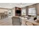 Open-concept living area with modern furnishings, a sleek entertainment center, and seamless flow to the kitchen at 4336 Guava Ct # 0, Las Vegas, NV 89135