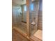Luxurious walk-in shower with elegant tile, seating and modern fixtures at 4336 Guava Ct # 0, Las Vegas, NV 89135