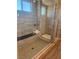Luxurious walk-in shower with elegant tile, seating and modern fixtures at 4336 Guava Ct # 0, Las Vegas, NV 89135