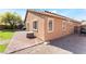Exterior view of a one-story house with a brick patio at 4508 Dragon Fly Creek Ave, North Las Vegas, NV 89031