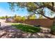Expansive backyard featuring a tree swing, lush artificial grass, and brick-paved patio perfect for outdoor entertaining at 4508 Dragon Fly Creek Ave, North Las Vegas, NV 89031