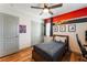 Bedroom with ceiling fan, wood-look floors and large closet at 4508 Dragon Fly Creek Ave, North Las Vegas, NV 89031