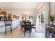 Bright dining room features tile flooring, modern lighting, and sliding glass doors offering backyard views at 4508 Dragon Fly Creek Ave, North Las Vegas, NV 89031