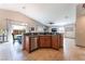 Open kitchen design with stainless steel appliances, breakfast bar, and access to the dining area at 4508 Dragon Fly Creek Ave, North Las Vegas, NV 89031