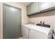 Well-lit laundry room with modern washer and dryer units at 4508 Dragon Fly Creek Ave, North Las Vegas, NV 89031
