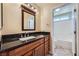 Bathroom with a black granite countertop and access to the shower and toilet at 4904 Meadows Encore Ave, Las Vegas, NV 89131