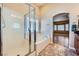 Bathroom featuring a glass enclosed shower and a separate tub with a window view at 4904 Meadows Encore Ave, Las Vegas, NV 89131