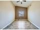 Neutral bedroom featuring tile floors and a ceiling fan for optimal comfort at 4904 Meadows Encore Ave, Las Vegas, NV 89131