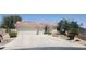 Charming single-story home with desert landscaping, a tile roof, and a three-car garage at 4904 Meadows Encore Ave, Las Vegas, NV 89131