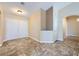 Bright foyer with tile floors and an arched doorway leading to other rooms at 4904 Meadows Encore Ave, Las Vegas, NV 89131