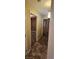 Hallway featuring ceramic tile floor with a view into a bedroom at 4904 Meadows Encore Ave, Las Vegas, NV 89131