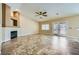 Open living area with vaulted ceiling, fireplace, neutral walls, and tile floors at 4904 Meadows Encore Ave, Las Vegas, NV 89131