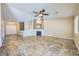 Spacious living room with a fireplace, tile flooring, and neutral color palette at 4904 Meadows Encore Ave, Las Vegas, NV 89131