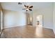 Large main bedroom showcasing wood floors and an arched doorway to the bathroom at 4904 Meadows Encore Ave, Las Vegas, NV 89131